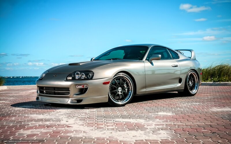 Silver Toyota Supra on a pier