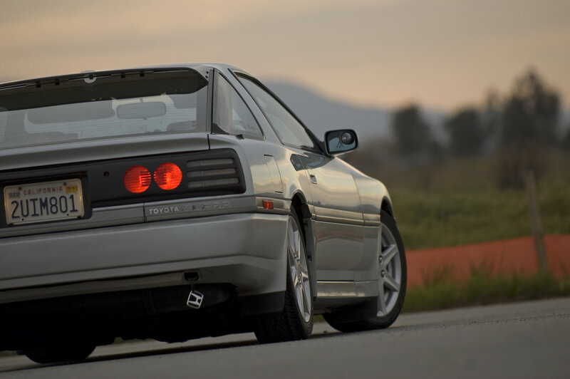 Silver Toyota Supra on a road