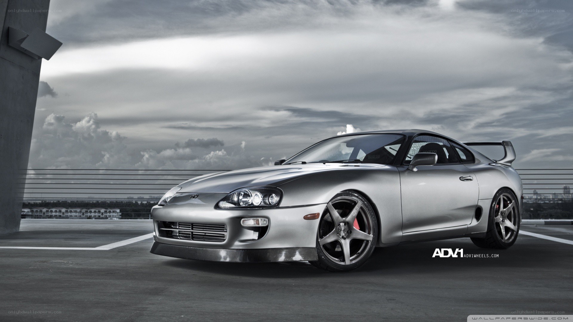silver toyota supra on rooftop