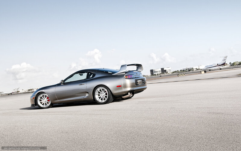 Silver Toyota Supra on tarmac