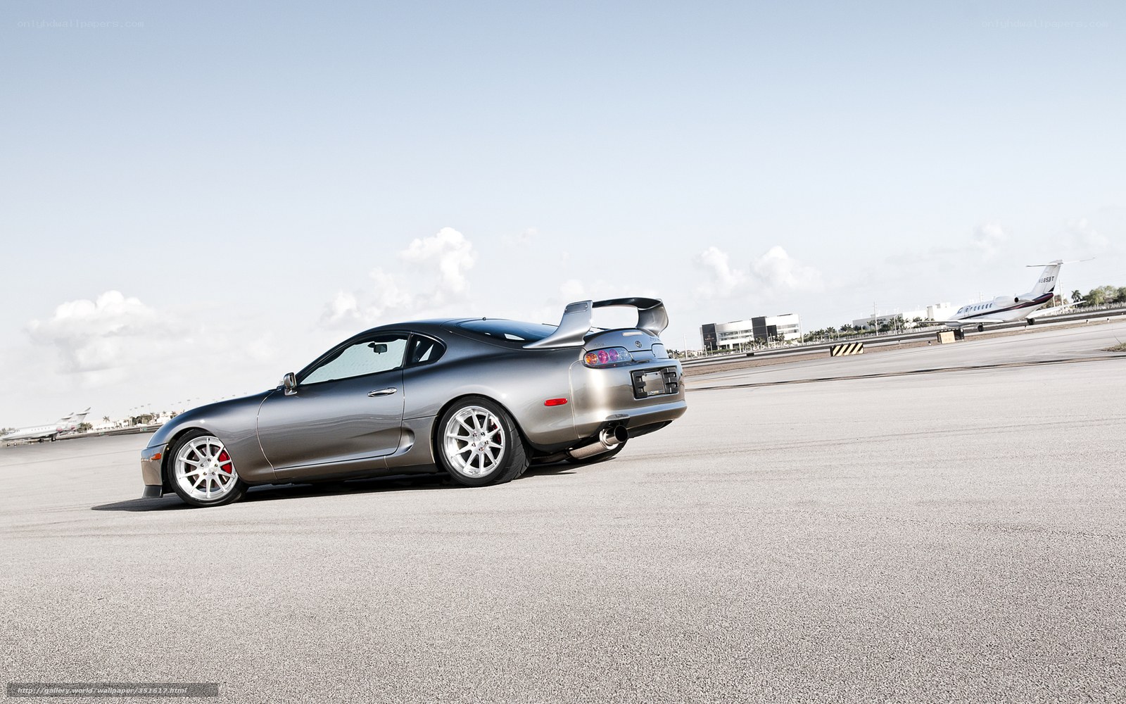 Silver Toyota Supra on tarmac