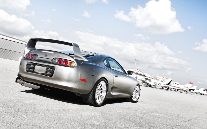 Silver Toyota Supra on tarmac