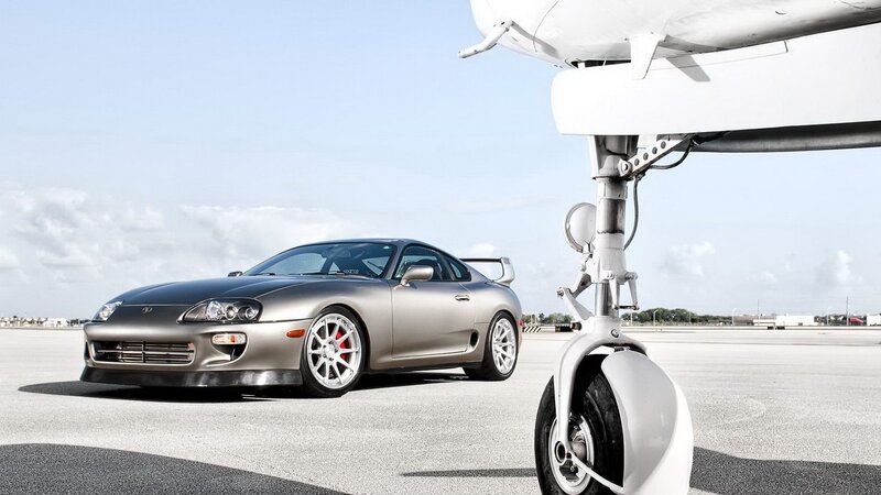 Silver Toyota Supra on tarmac