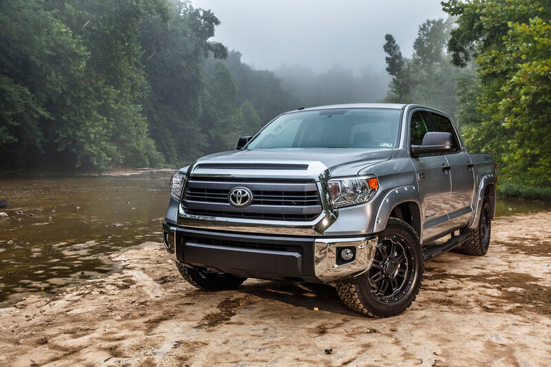 Silver Toyota Tundra by river