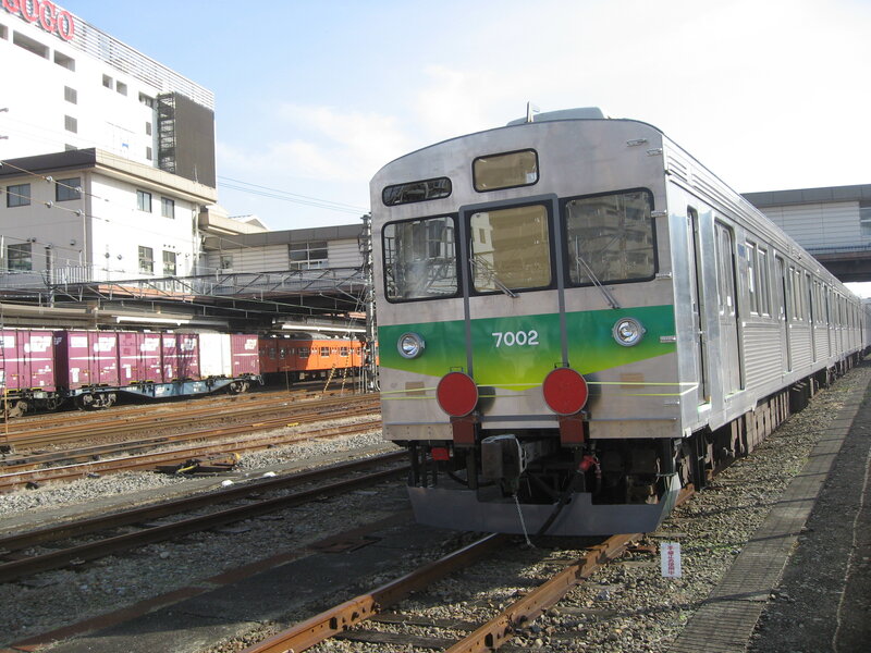 Silver train at a station