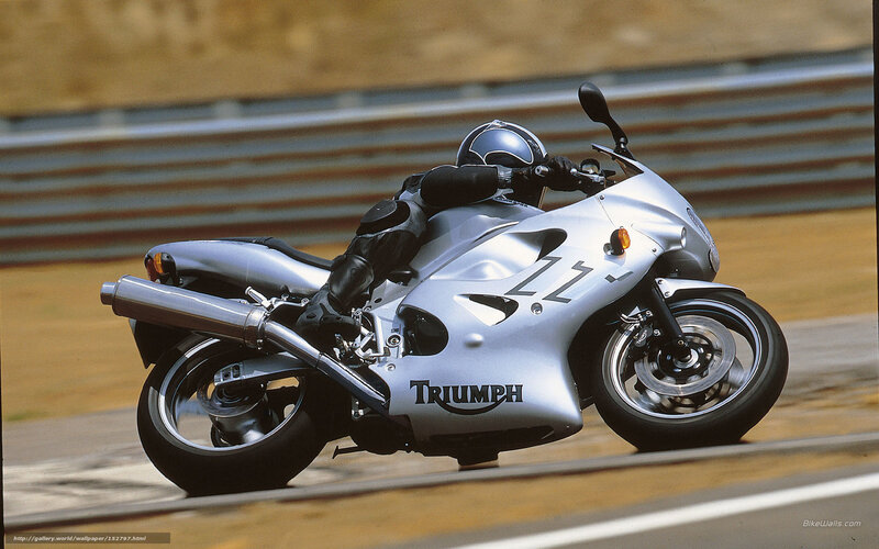 Silver Triumph motorcycle on track
