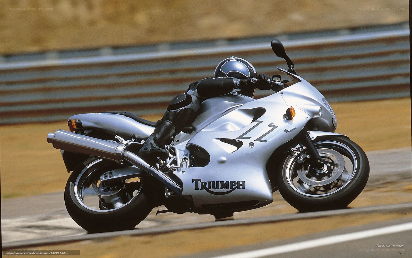 Silver Triumph motorcycle on track