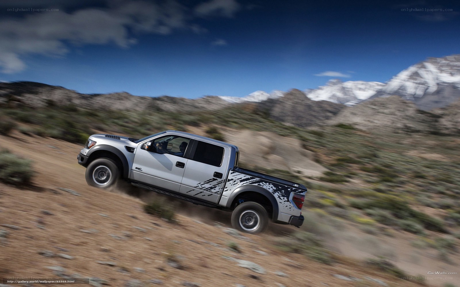 silver truck on dirt road