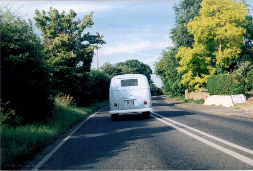 Silver van on a country road