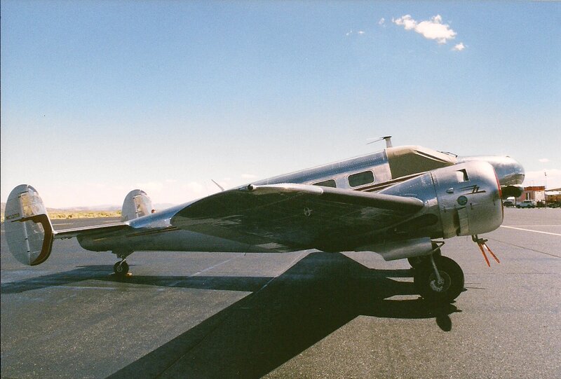 Silver Vintage Airplane — Gray, Calm, Afternoon, Photograph