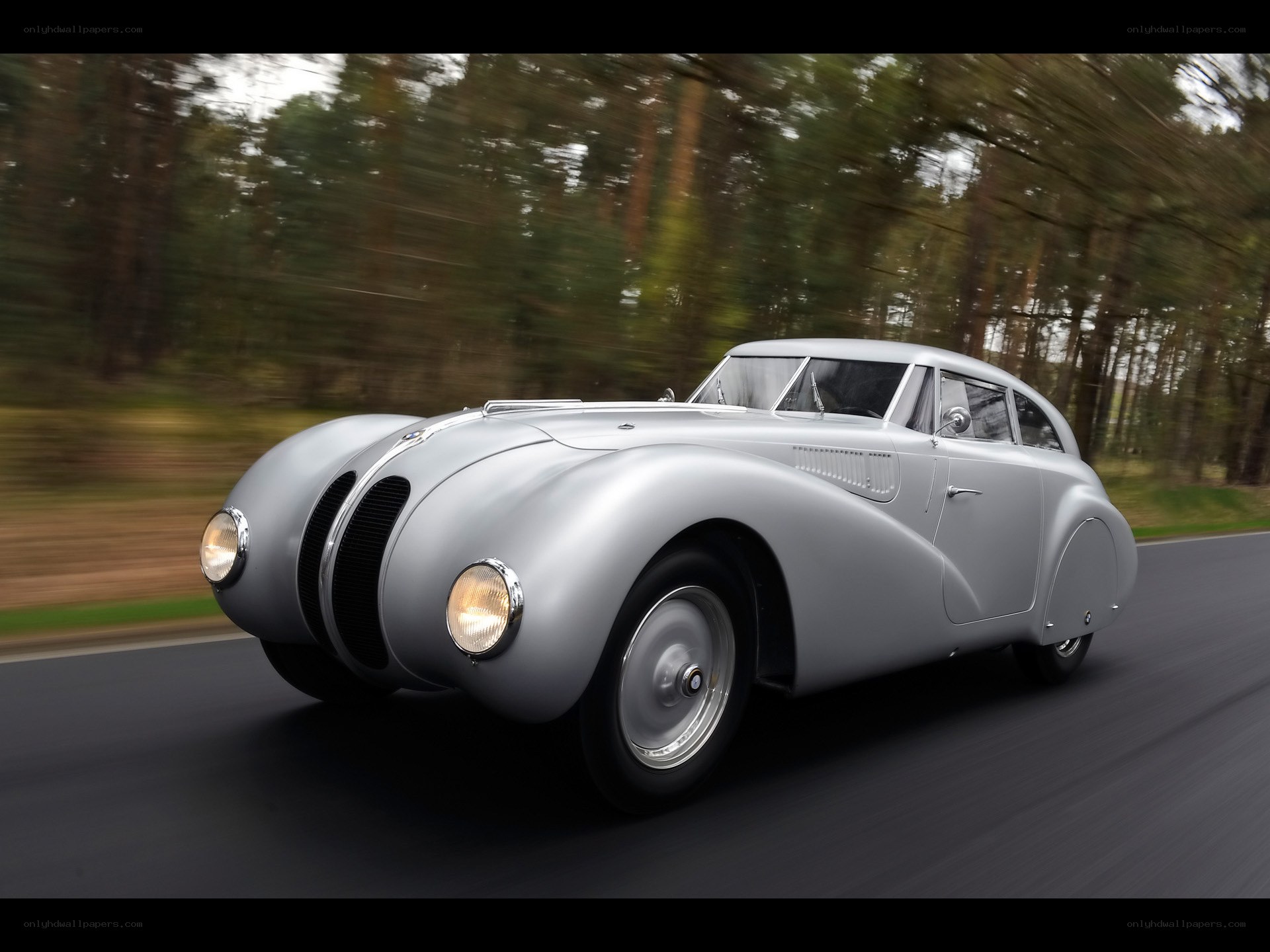 Silver vintage car in motion