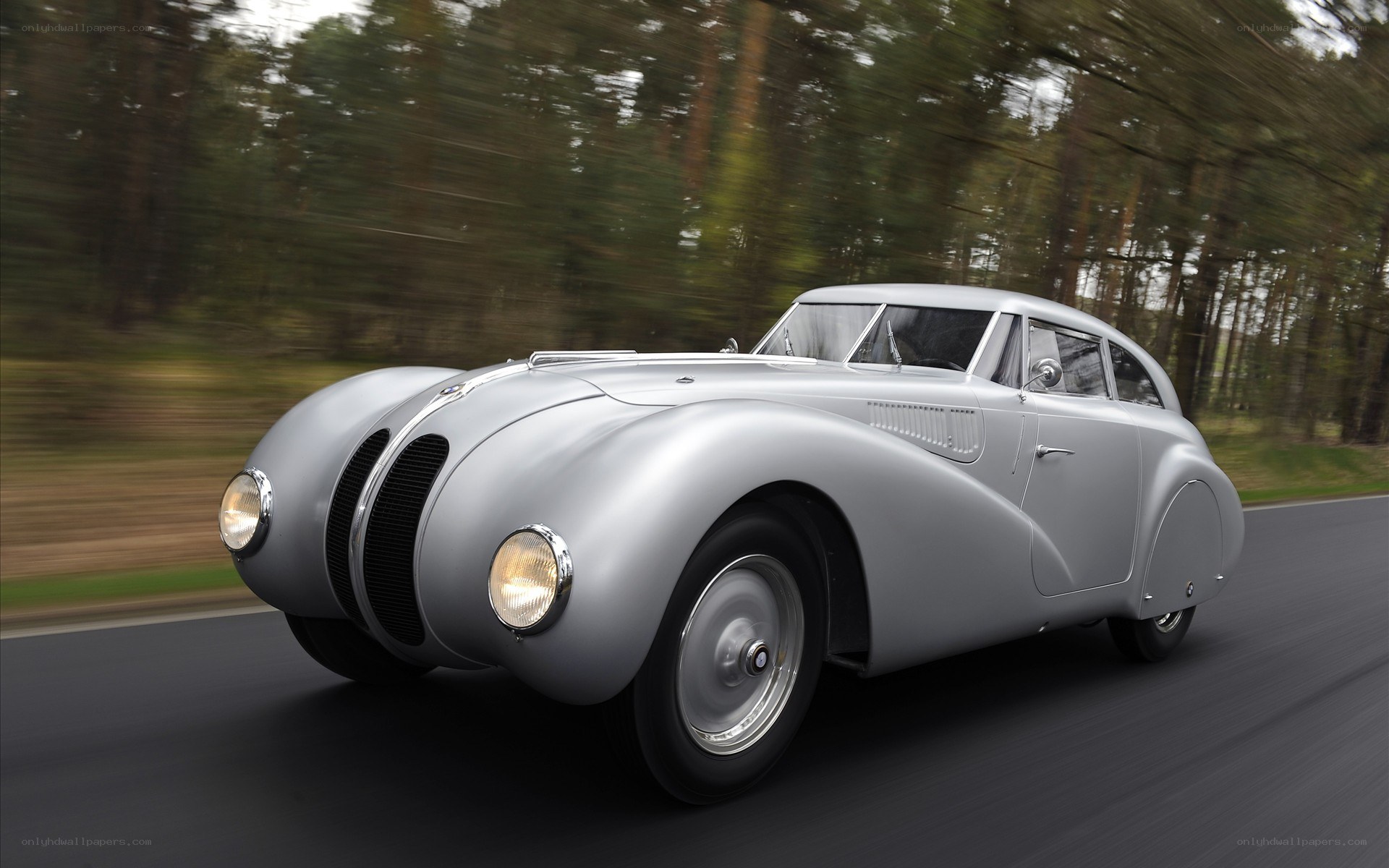 Silver vintage car in motion