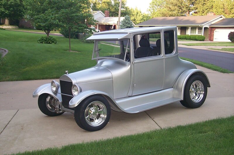 Silver vintage car on driveway