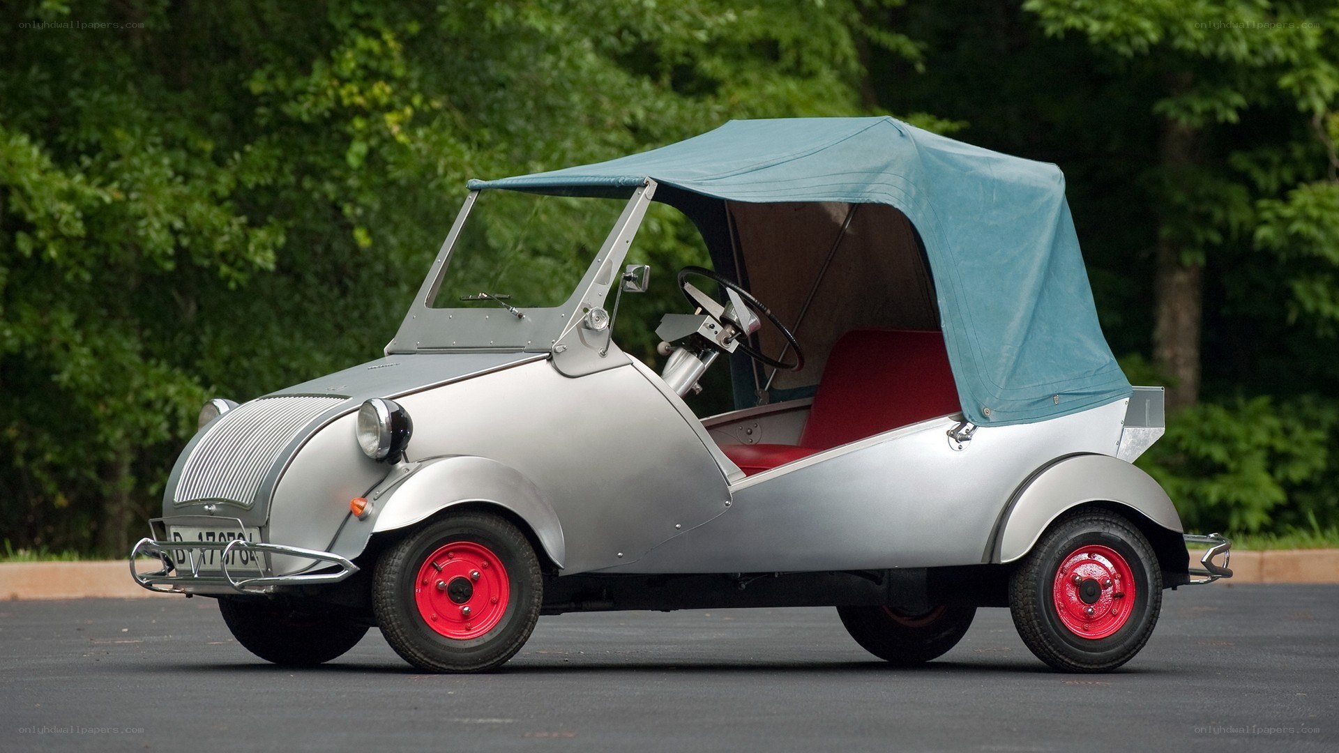 Silver vintage microcar with blue top