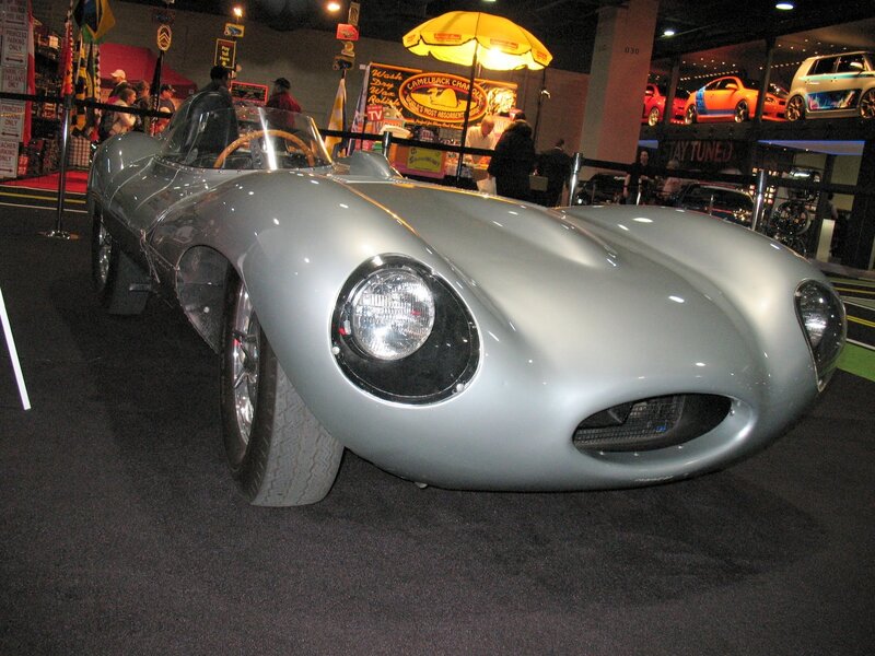 Silver vintage race car on display