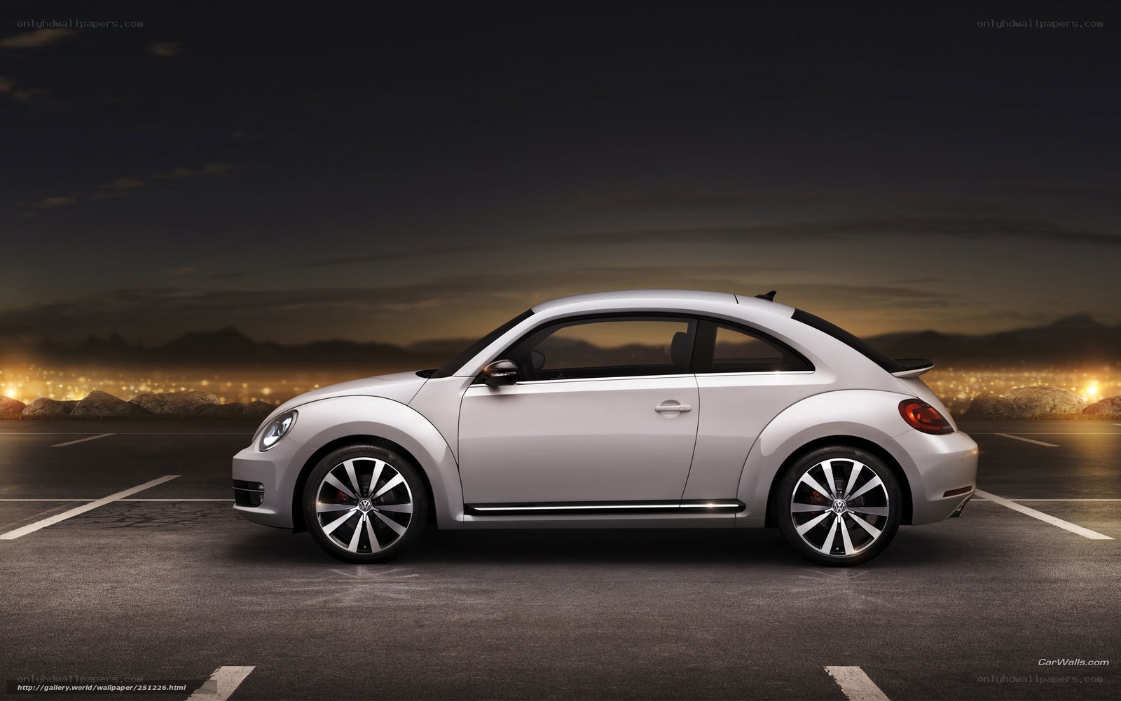 Silver Volkswagen Beetle at dusk