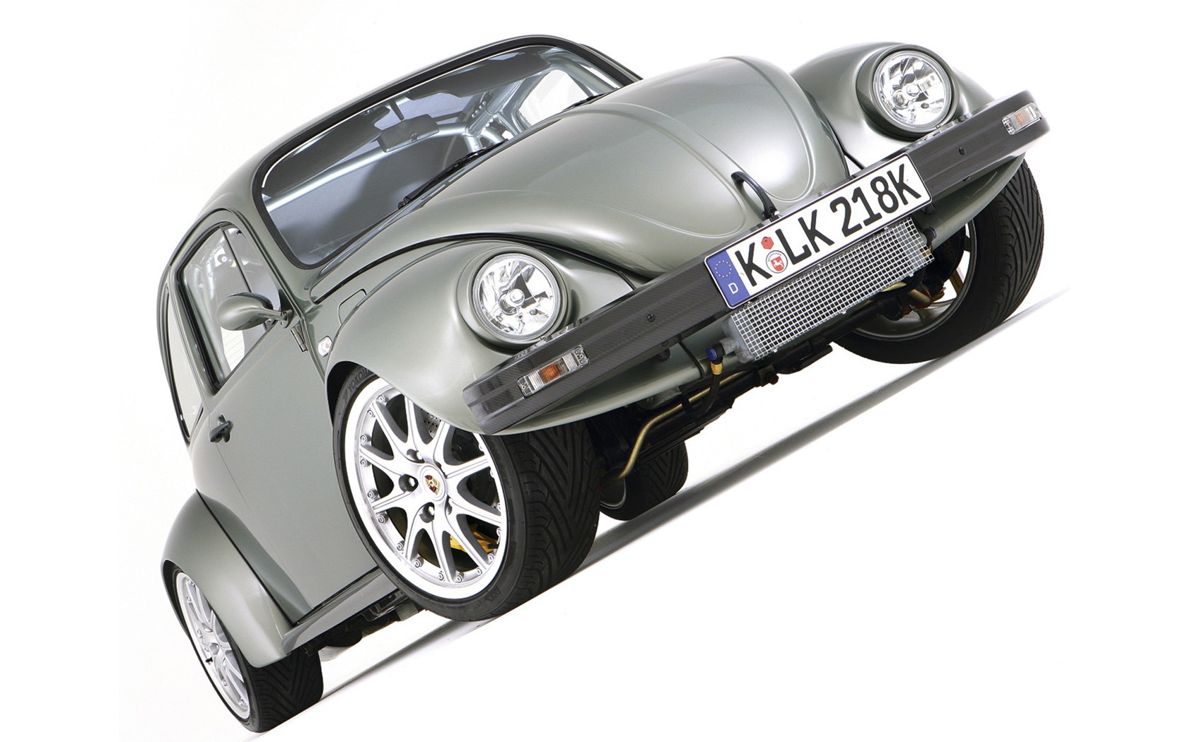 Silver Volkswagen Beetle with custom wheels