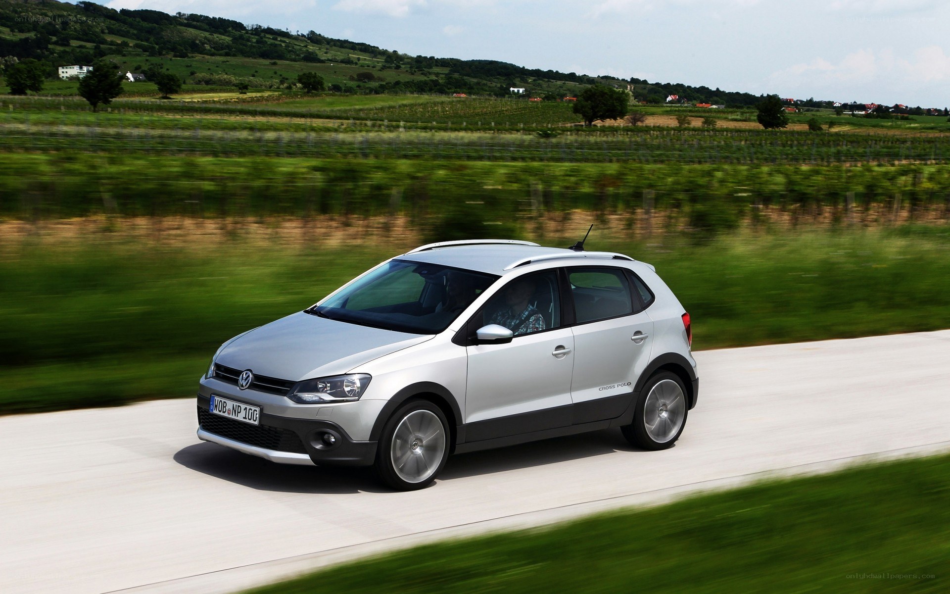 Silver Volkswagen Cross Polo driving