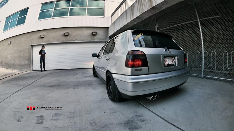 silver volkswagen golf in parking area