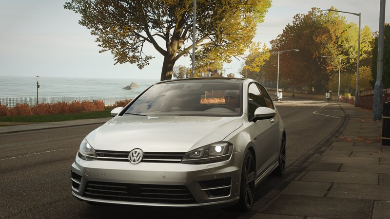 Silver Volkswagen Golf — White
