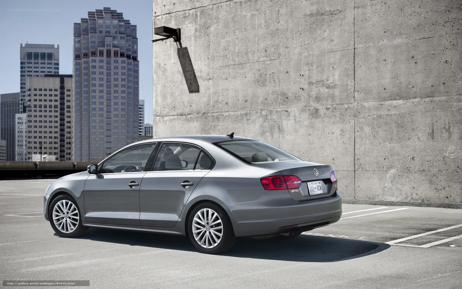 Silver Volkswagen Jetta in city parking