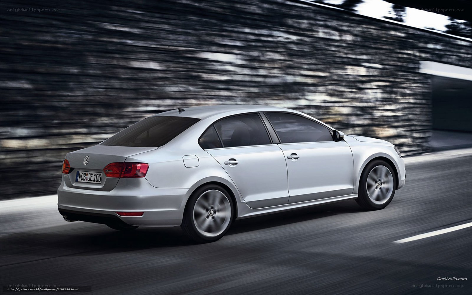 silver volkswagen jetta in motion
