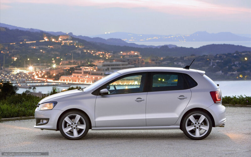 Silver Volkswagen Polo at dusk