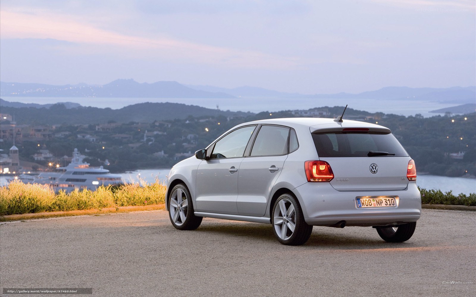 Silver Volkswagen Polo by the coast