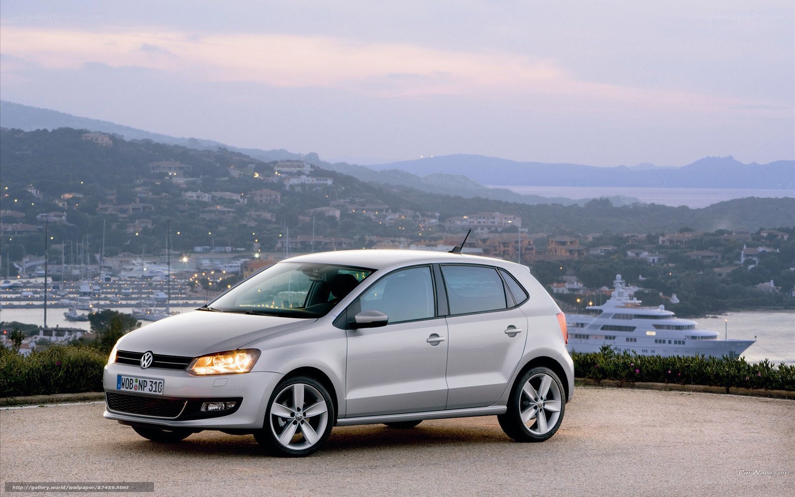 Silver Volkswagen Polo by the harbor