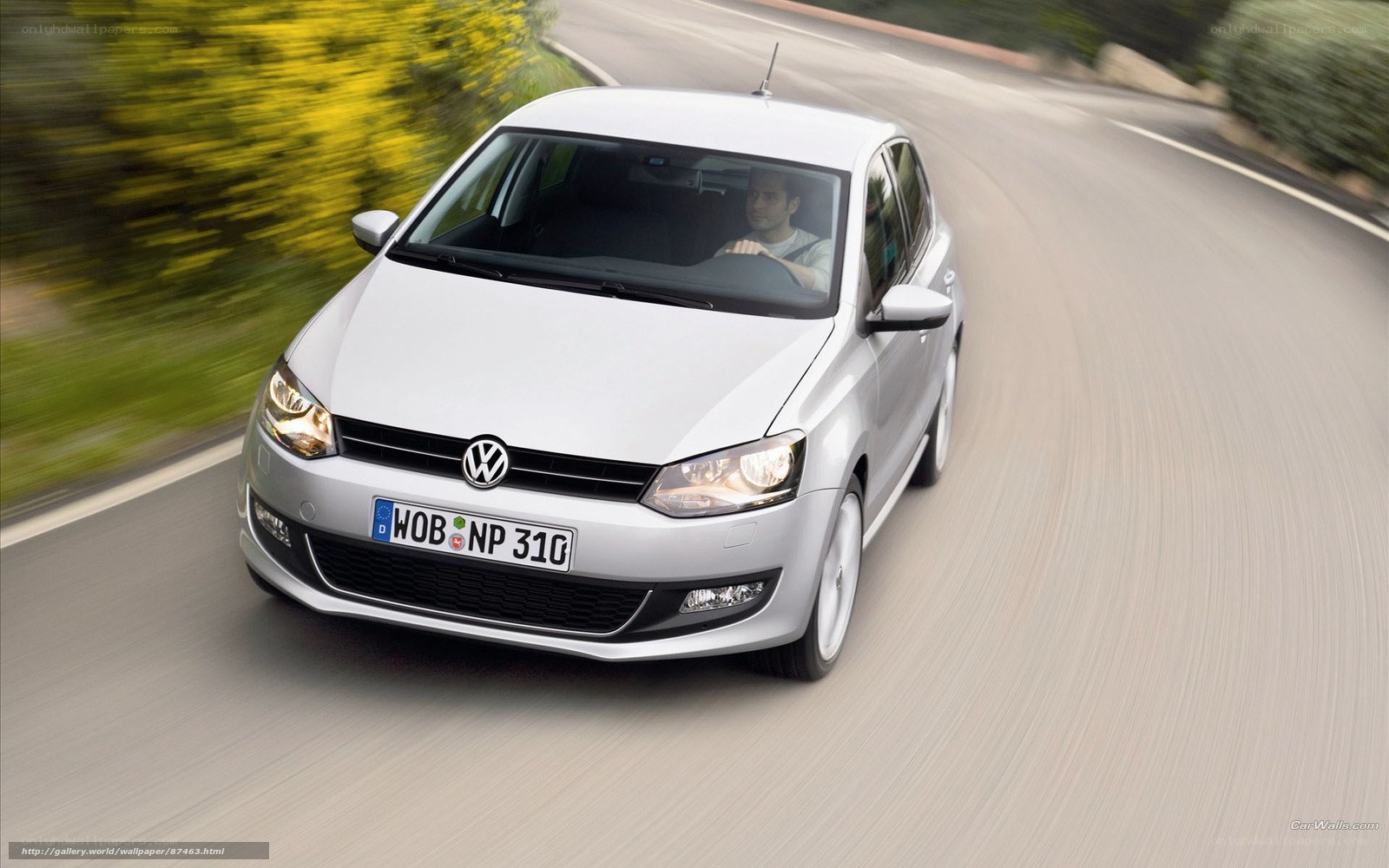 silver volkswagen polo driving