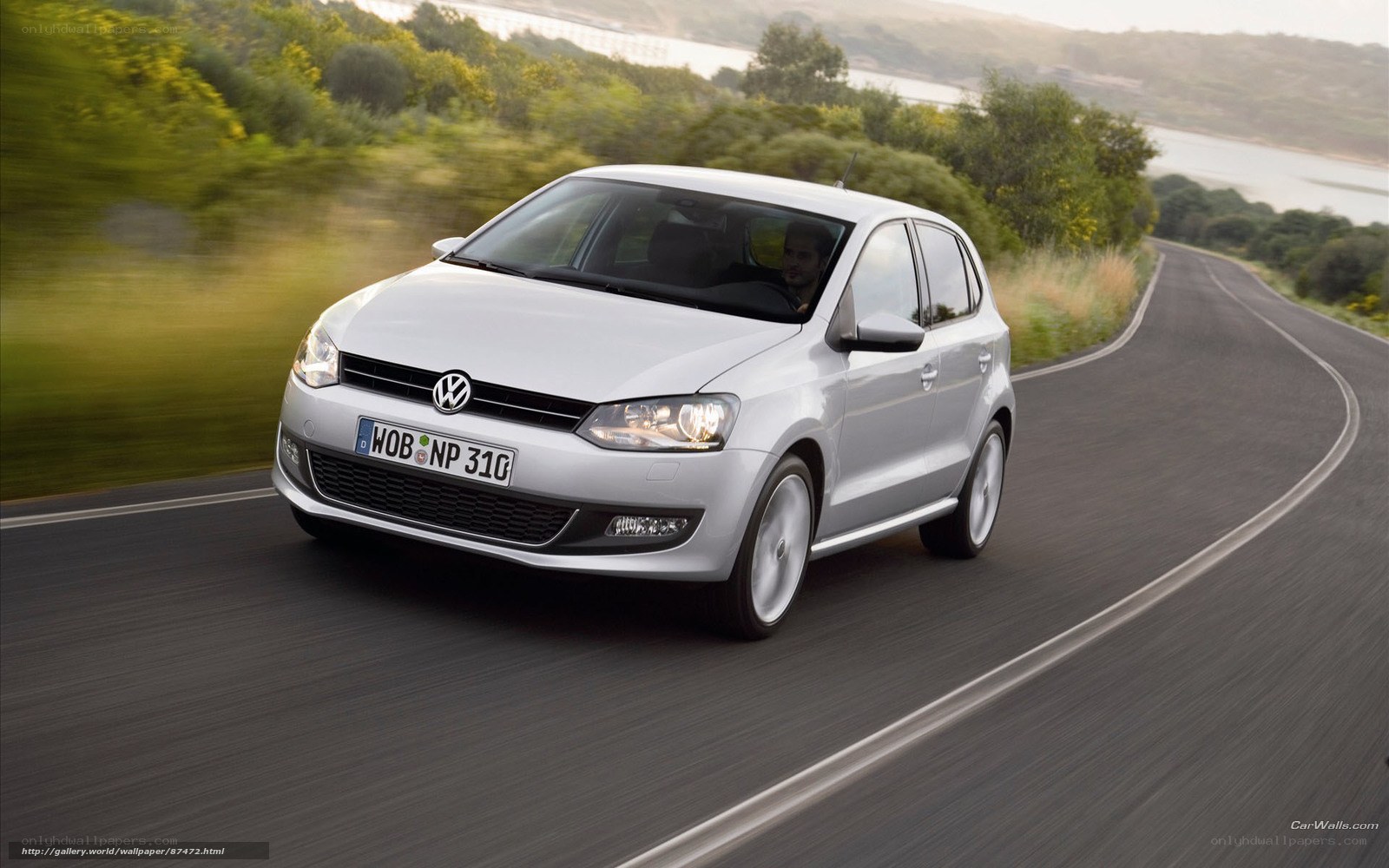 Silver Volkswagen Polo on a winding road