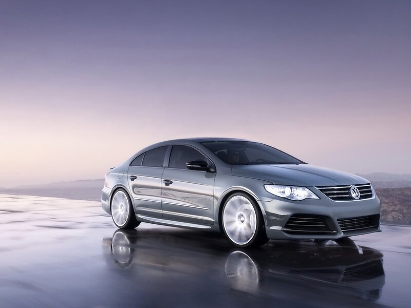 Silver Volkswagen sedan on wet road