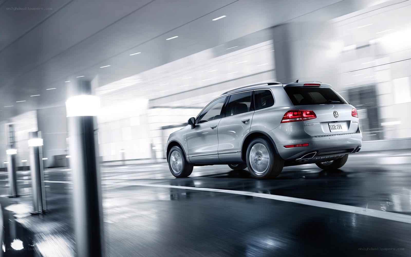 silver volkswagen suv in motion