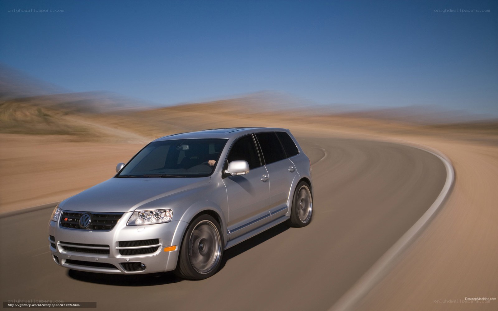 silver volkswagen suv on desert road