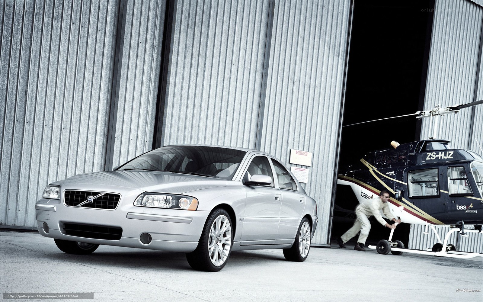 Silver Volvo and helicopter