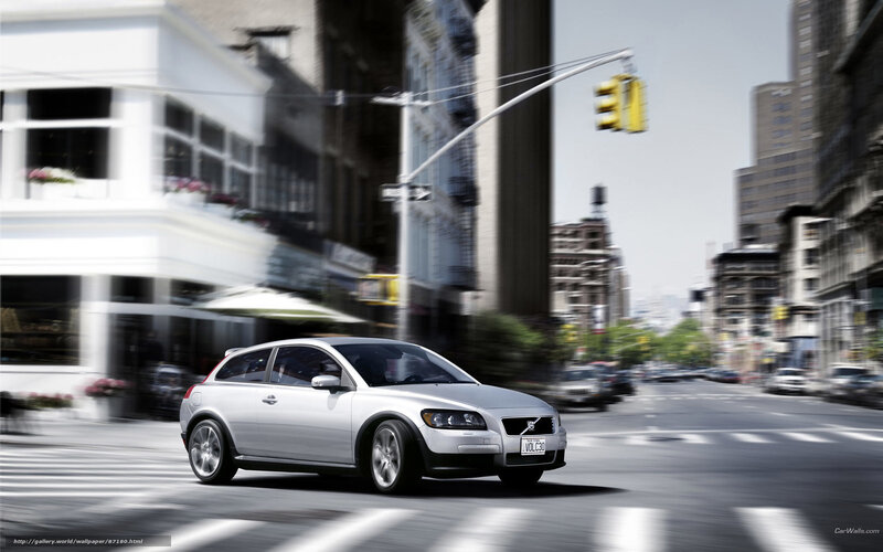 Silver Volvo C30 in city traffic
