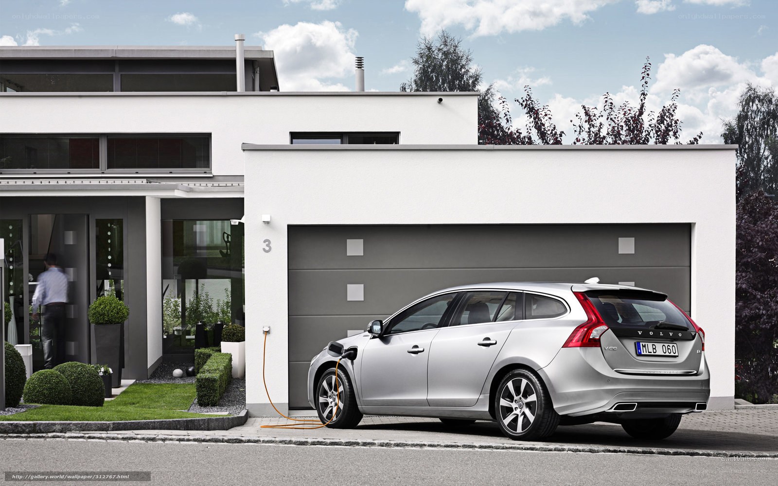 Silver Volvo charging at home
