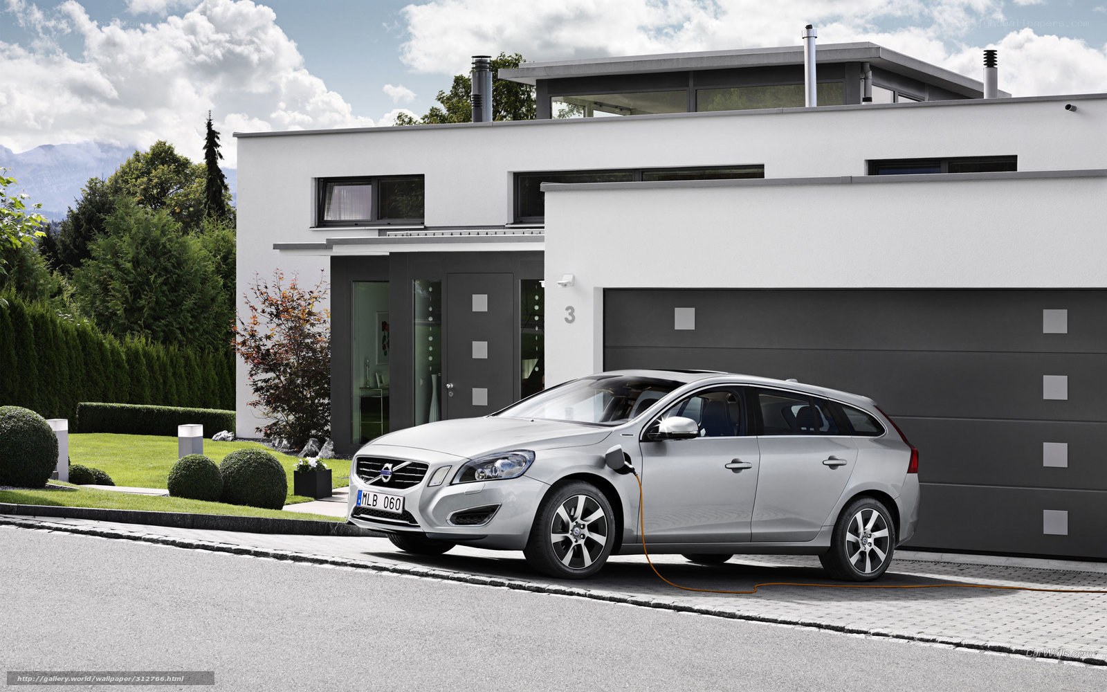 Silver Volvo charging at home