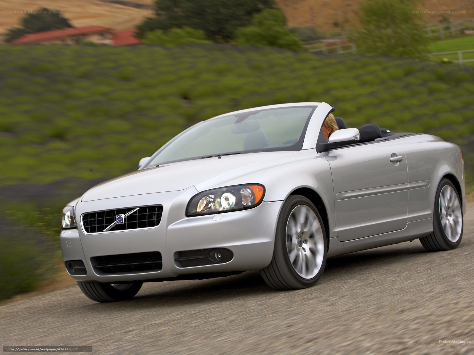 silver volvo convertible driving