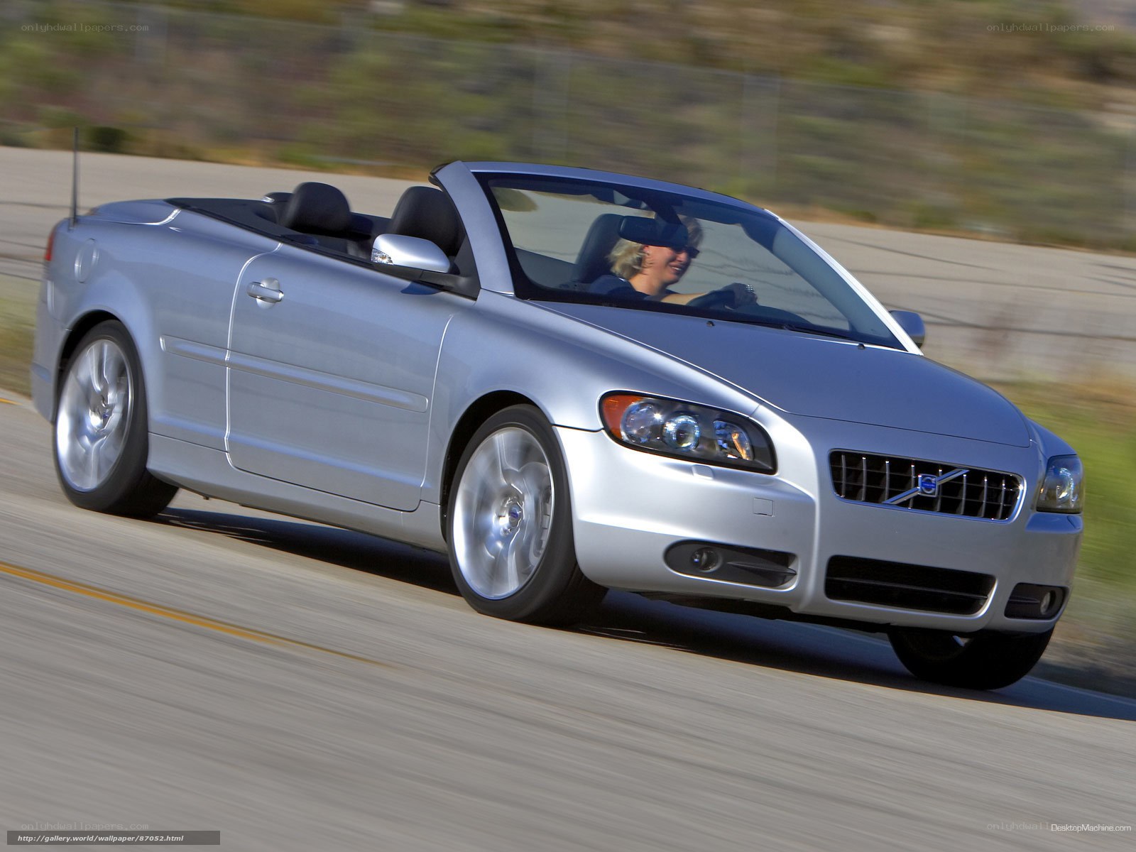 silver volvo convertible driving