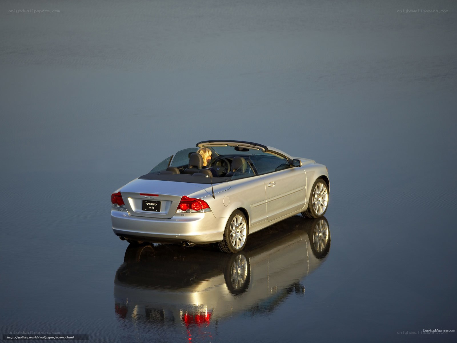 Silver Volvo Convertible on Water