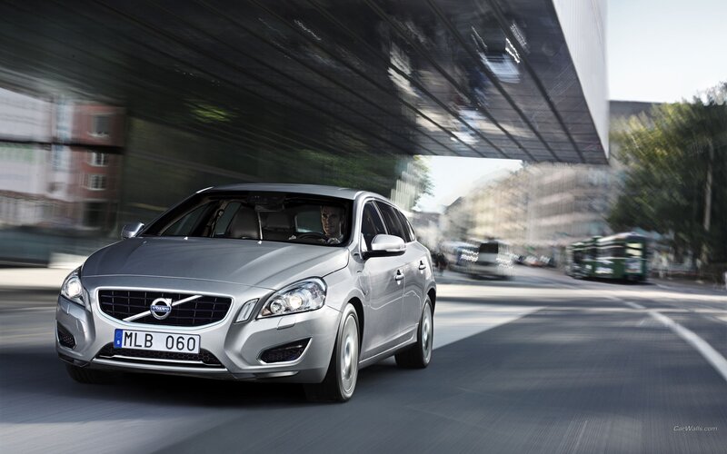 Silver Volvo driving on city street