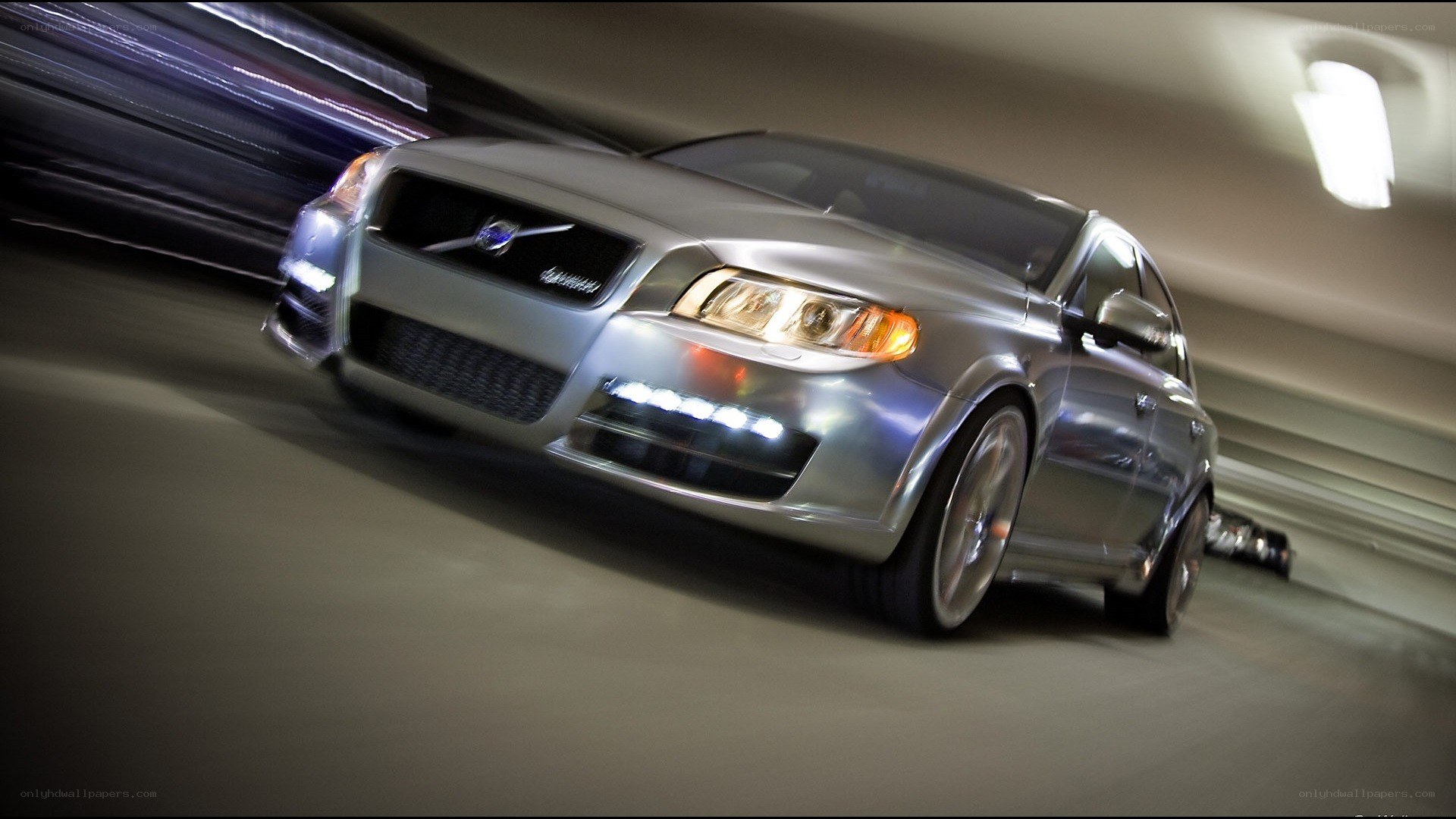 silver volvo in motion