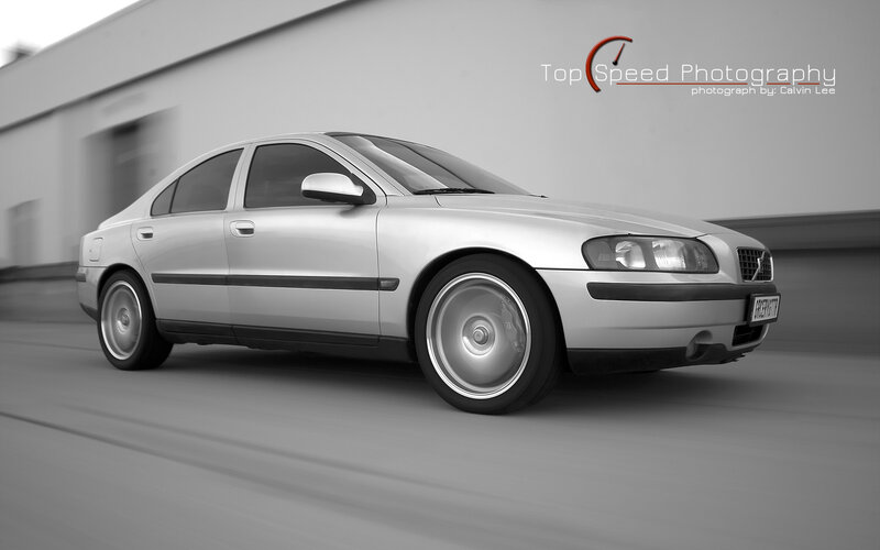 silver volvo in motion