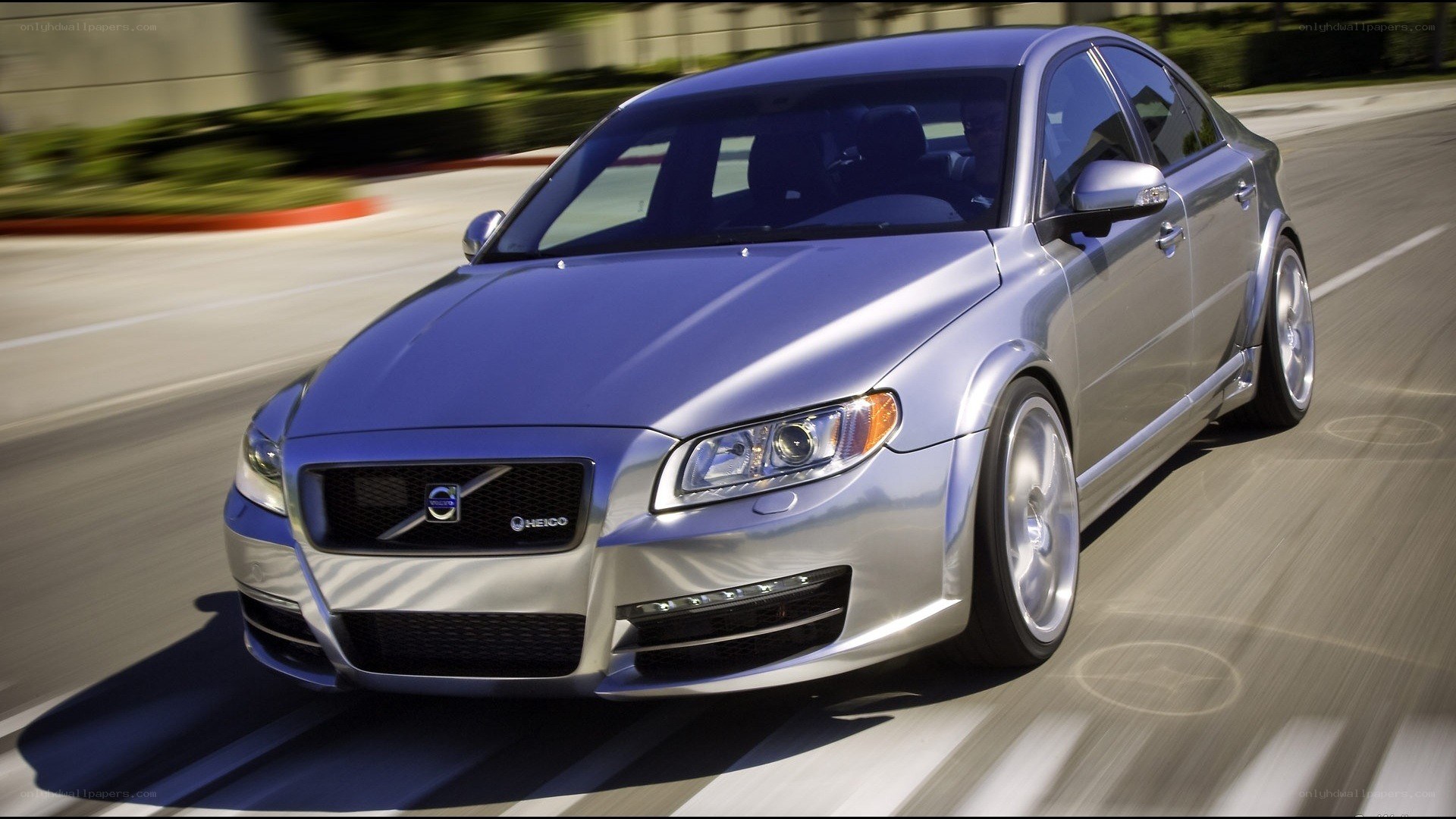 silver volvo in motion