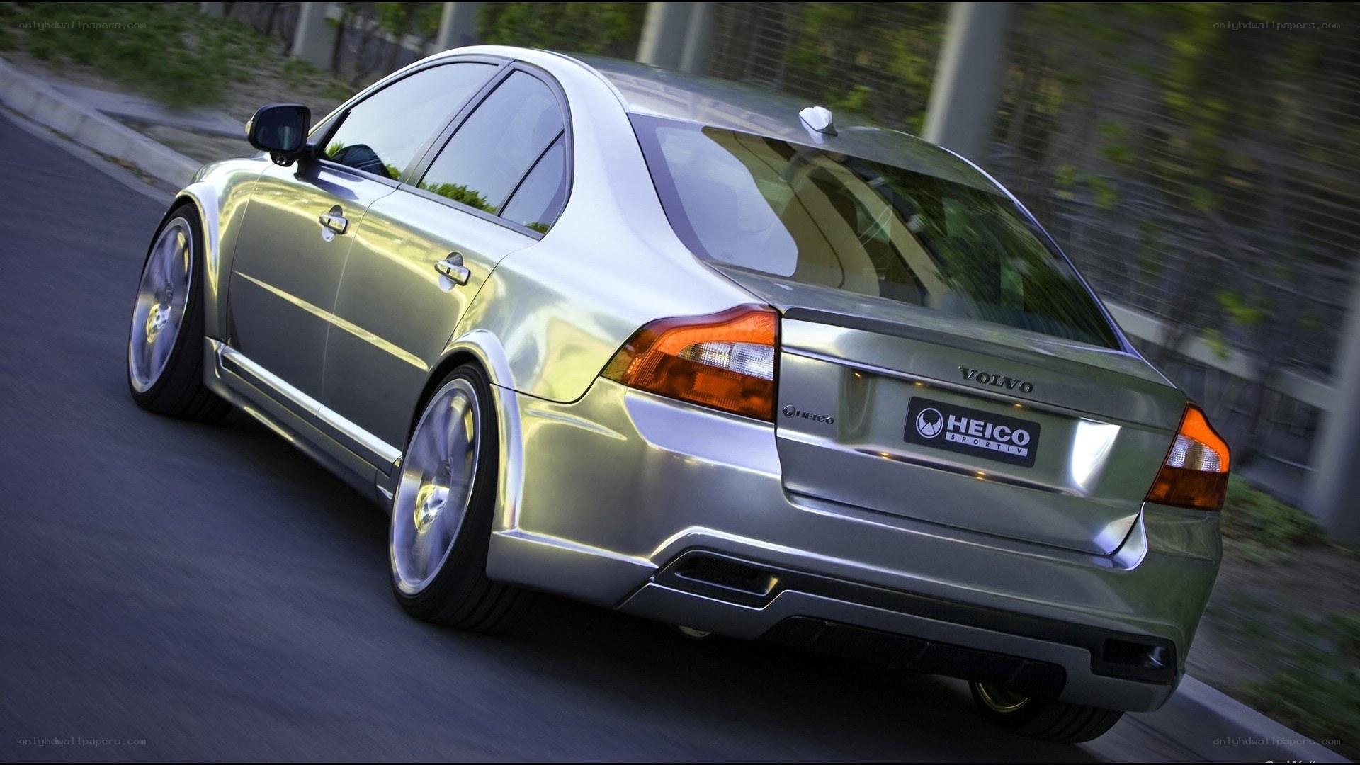 silver volvo in motion