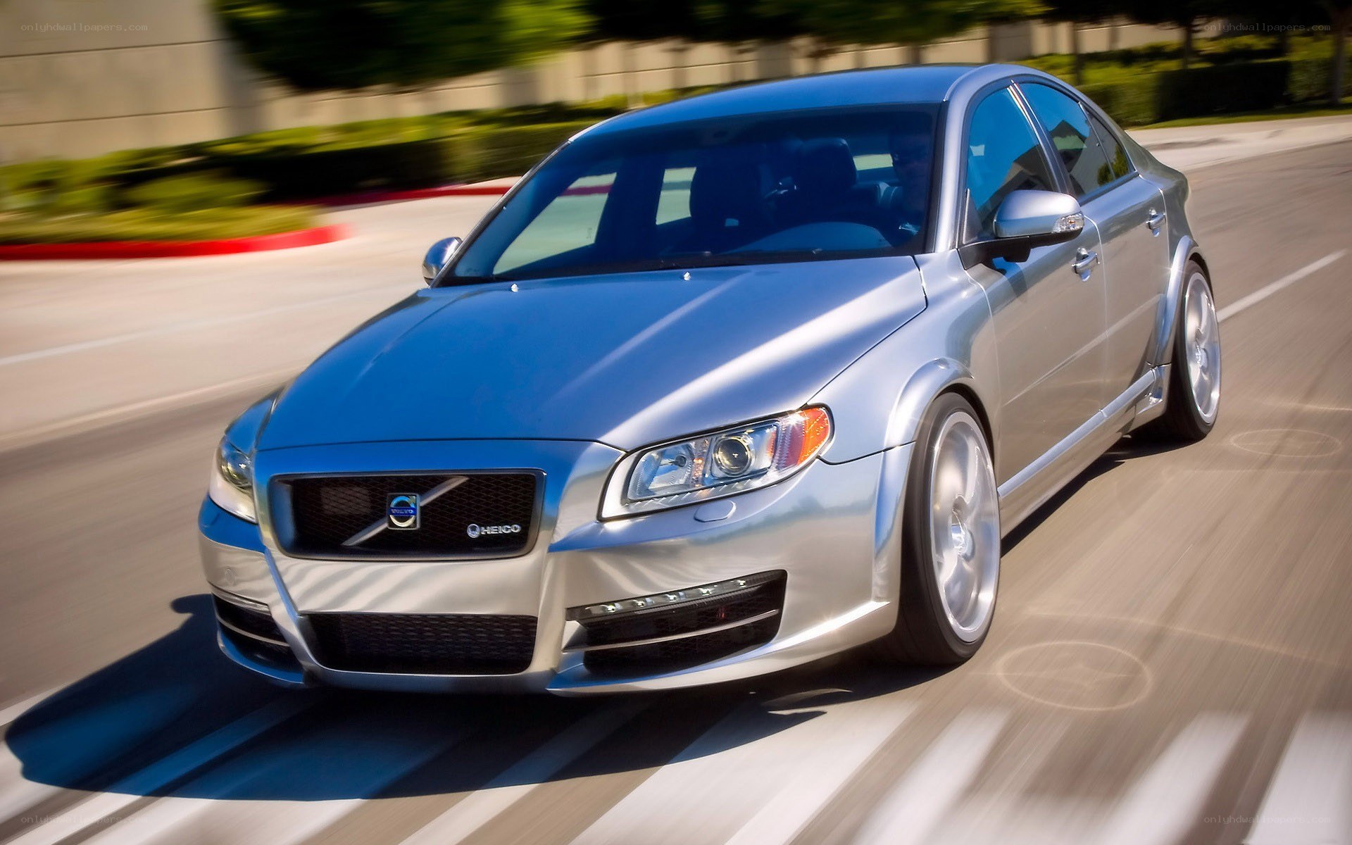 silver volvo in motion