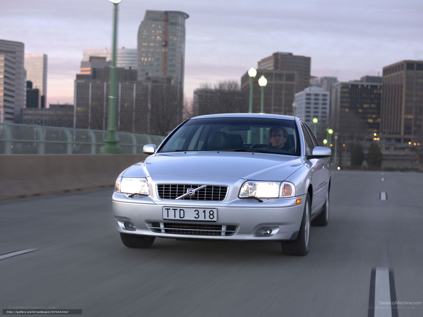 silver volvo on city bridge