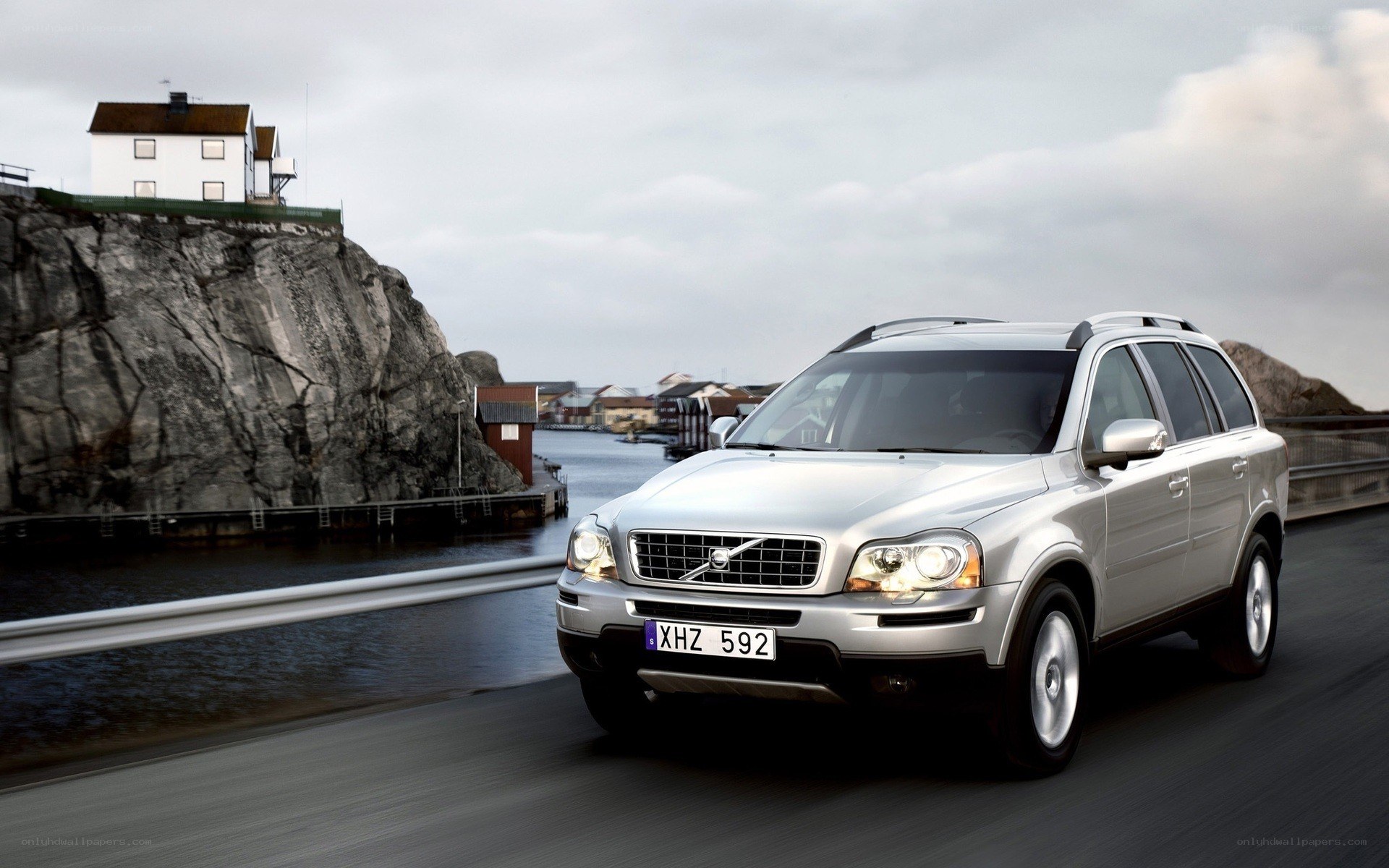 Silver Volvo on coastal road