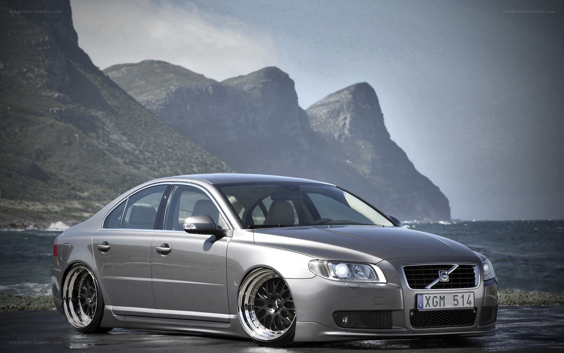 silver volvo on coastal road